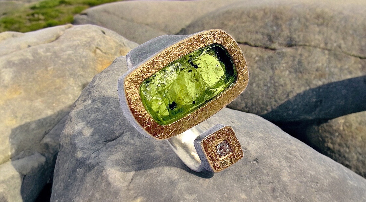 rectangular rough peridot ring with diamond in silver and gold