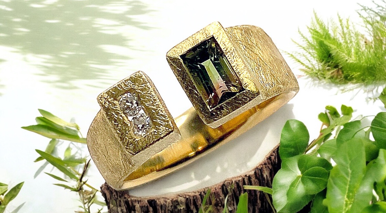 tricolor tourmaline ring with two diamonds in a row in gold