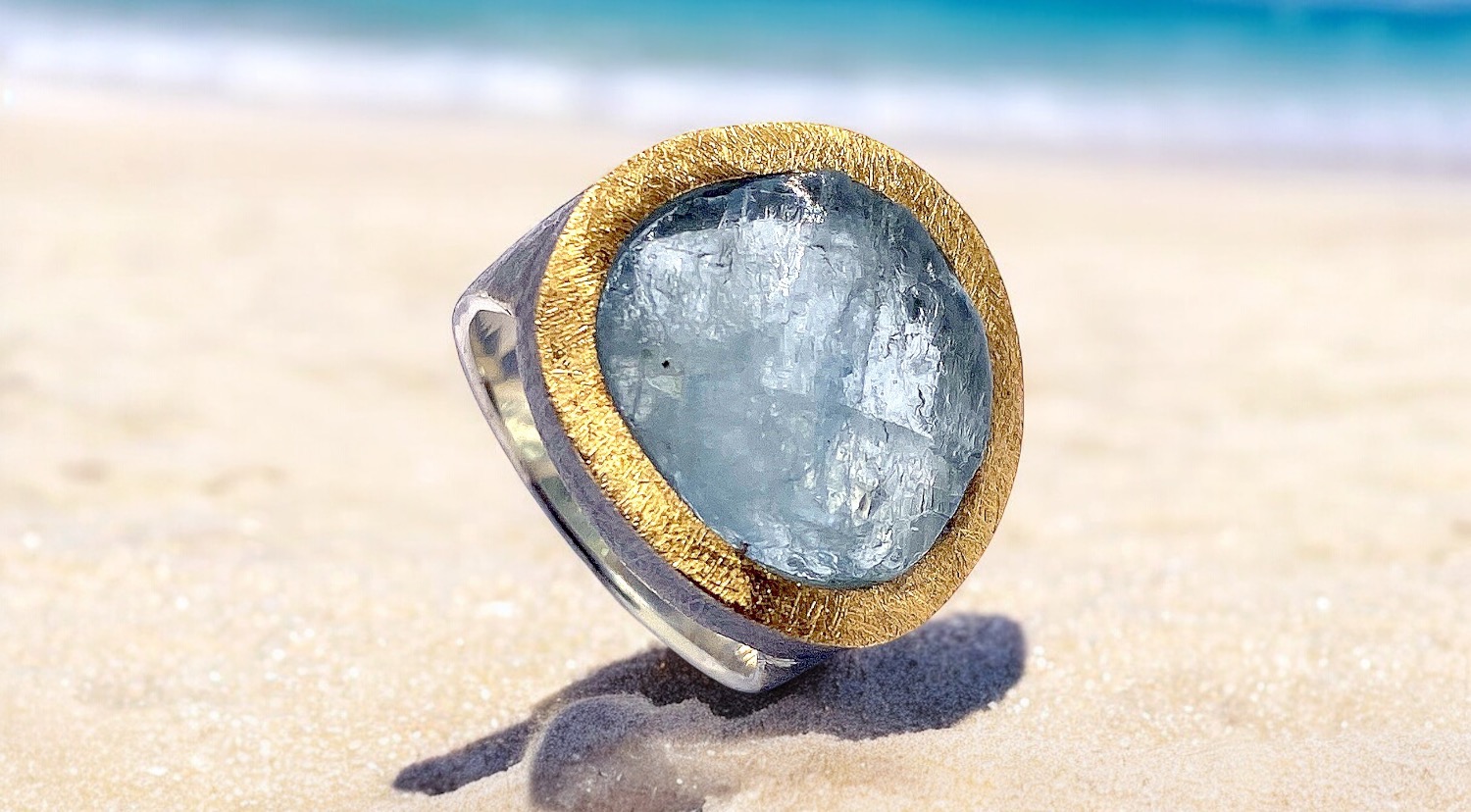 round rough aquamarine ring in silver and gold