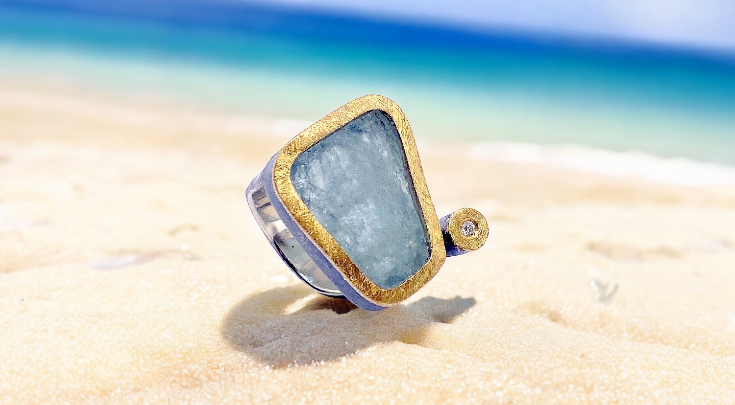 triangular rough aquamarine ring with diamond in silver and gold