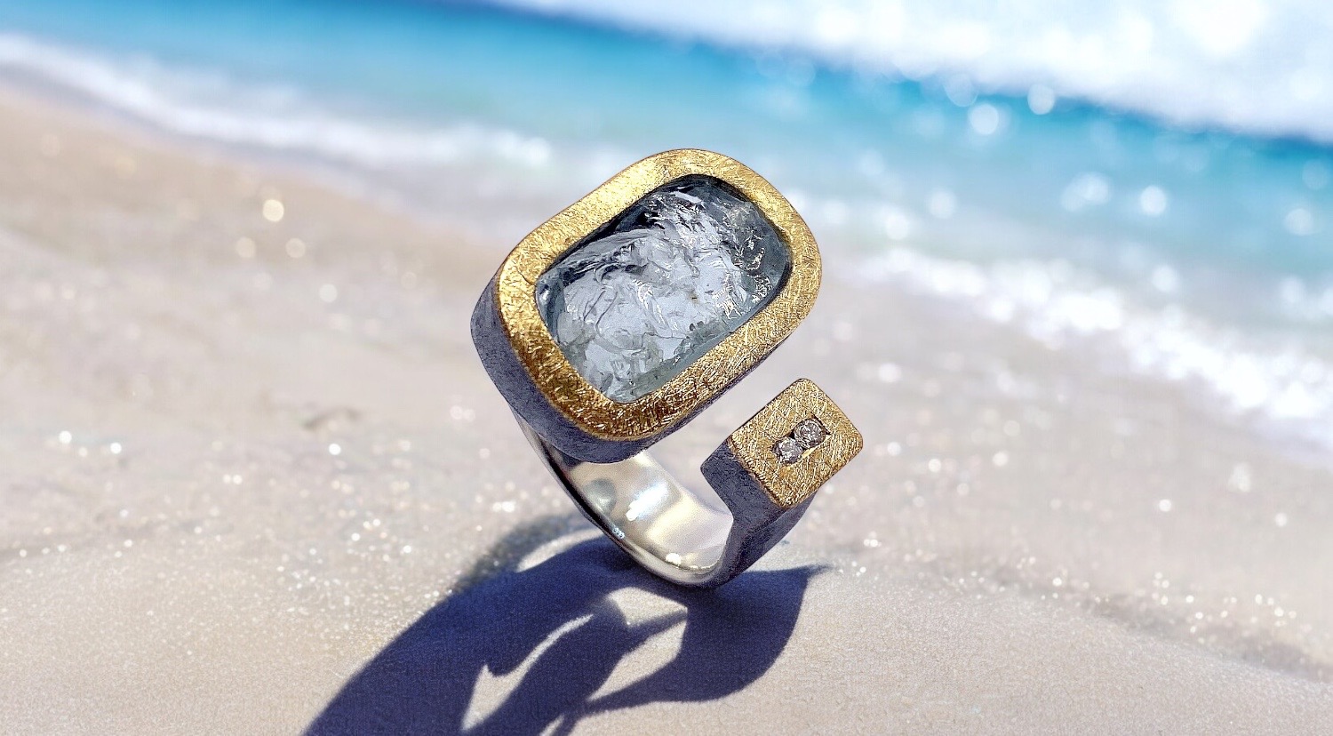 rectangular rough aquamarine ring with 2 diamonds in silver and gold