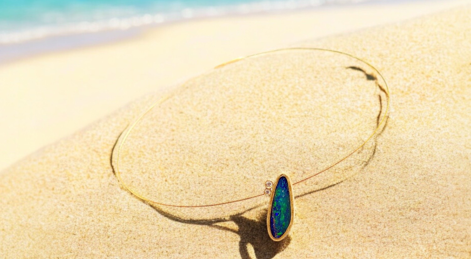 oval opal pendant with two diamonds in gold