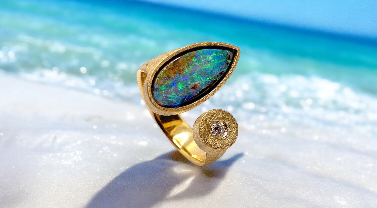 tear australian boulder opal ring with diamond in gold