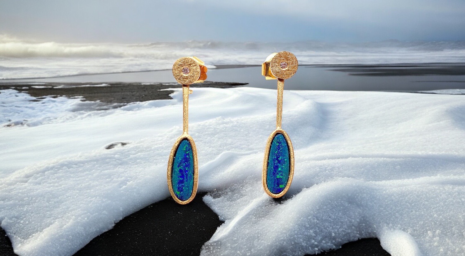 large oval opal earrings with diamond in gold