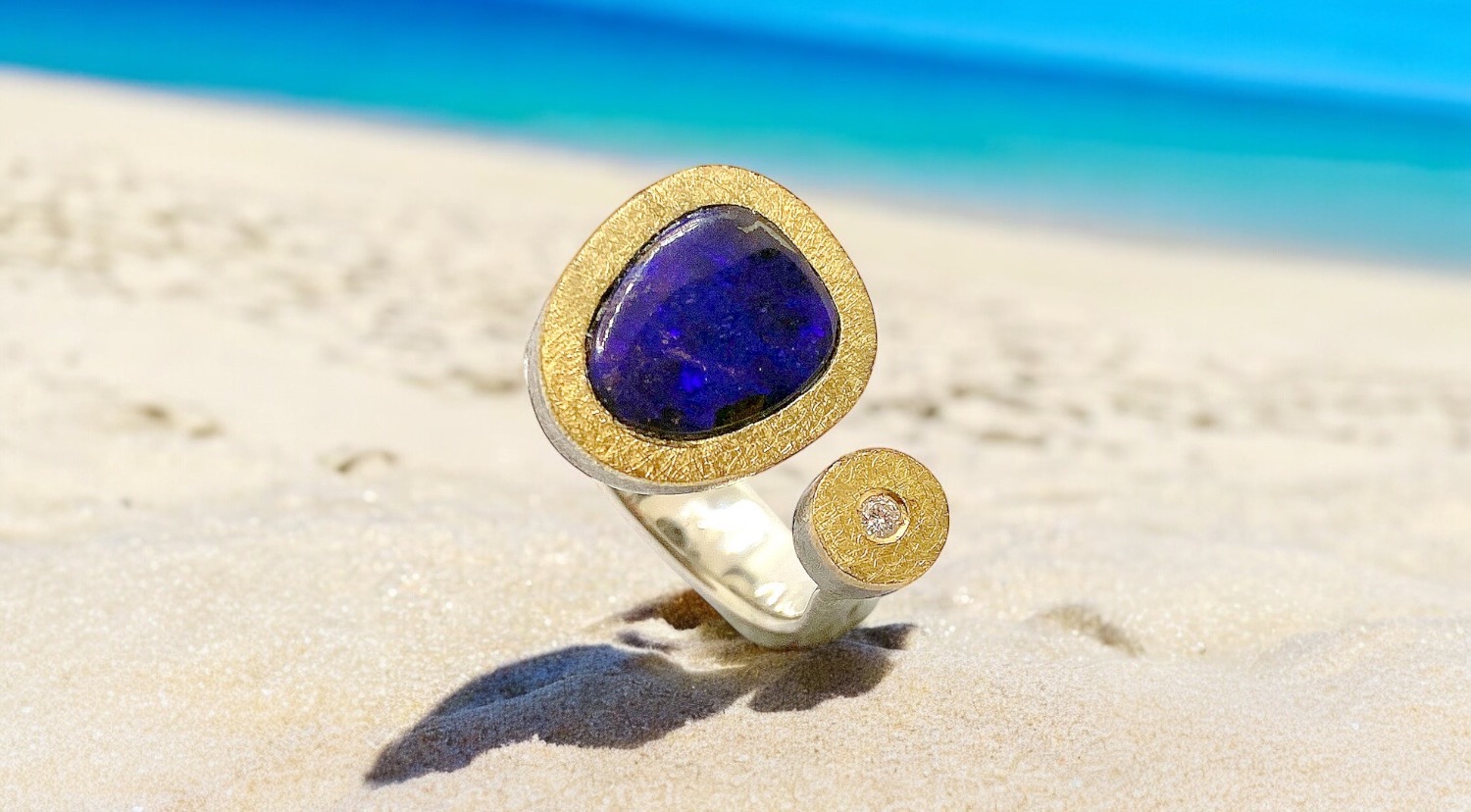 purple boulder opal ring with diamond in silver and gold