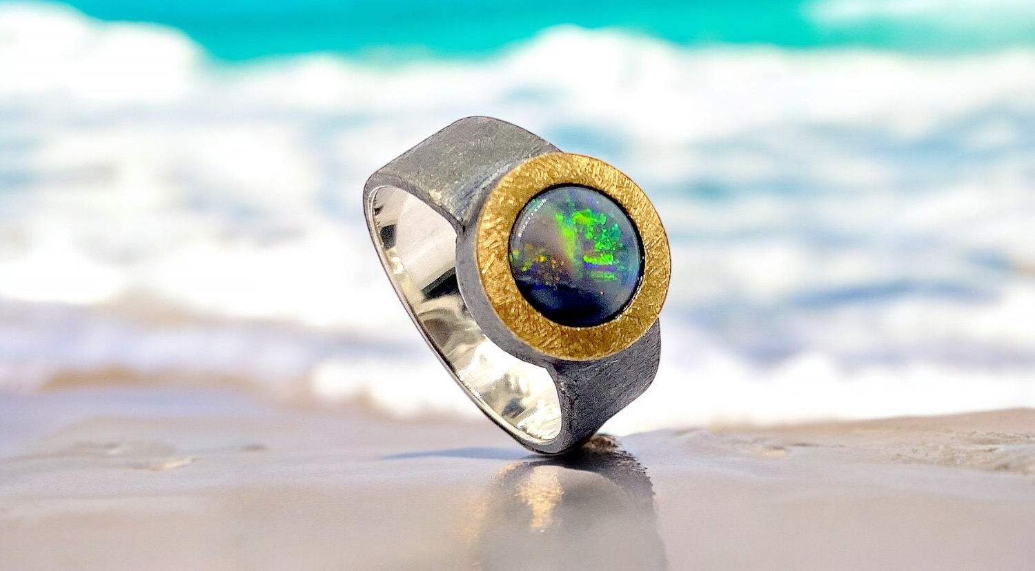 round opal ring in silver and gold