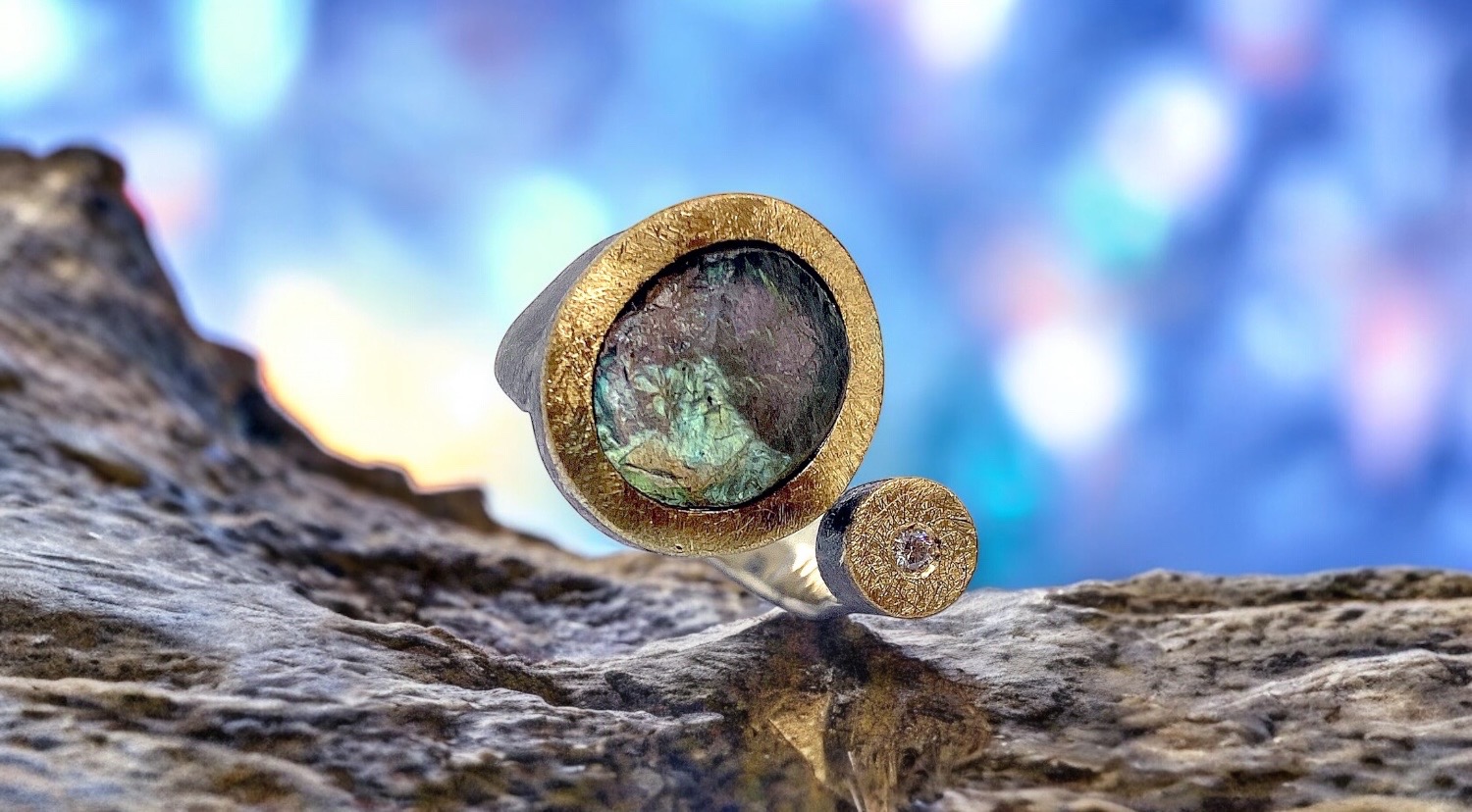 oval rough labradorite ring with diamond in silver and gold